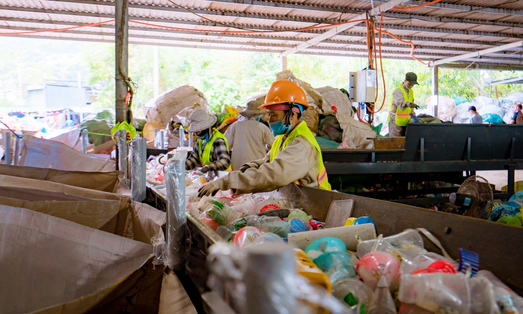 workers in vietnam sorting plastic recycling